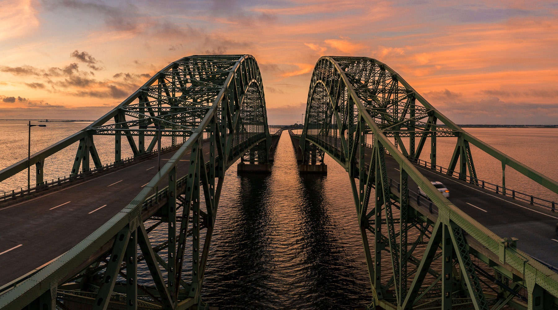 Twin bridges crossing body of water